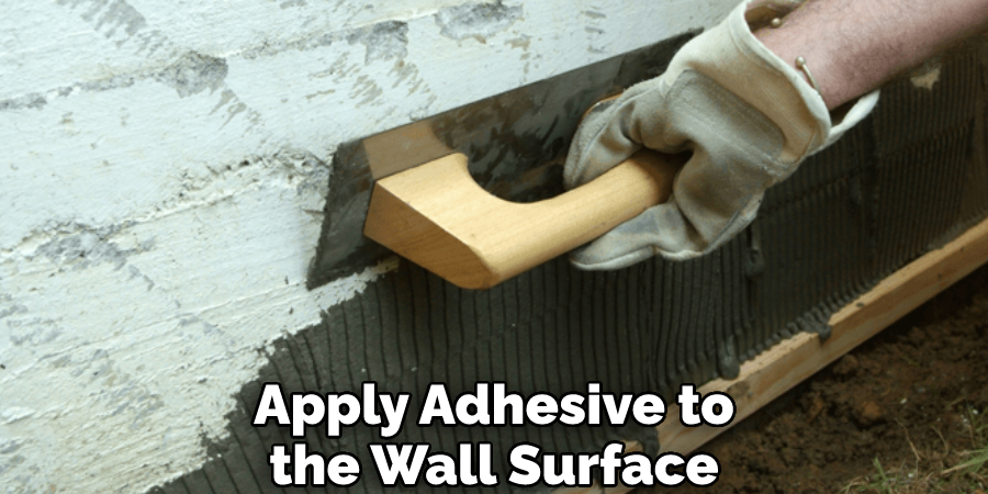 Apply Adhesive to the Wall Surface