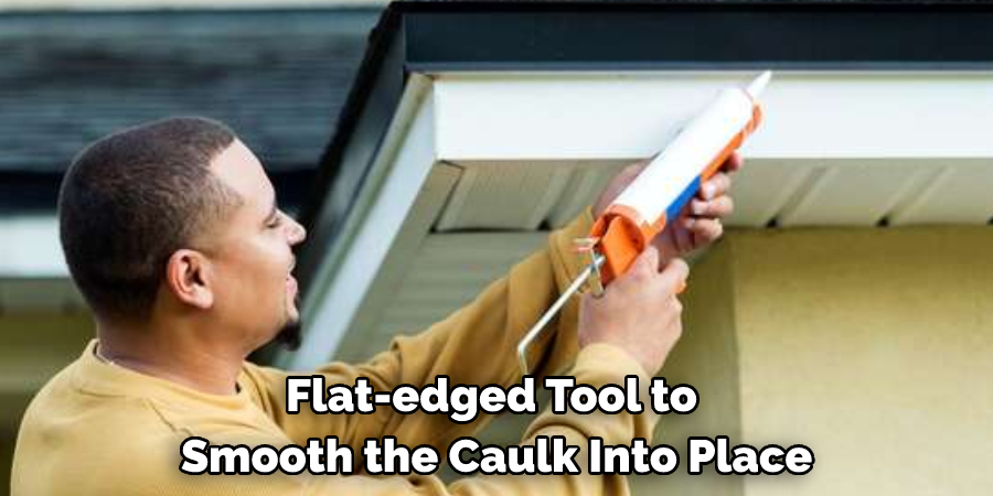 Flat-edged Tool to Smooth the Caulk Into Place