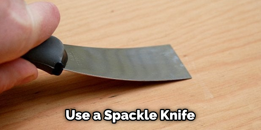 Use a Spackle Knife