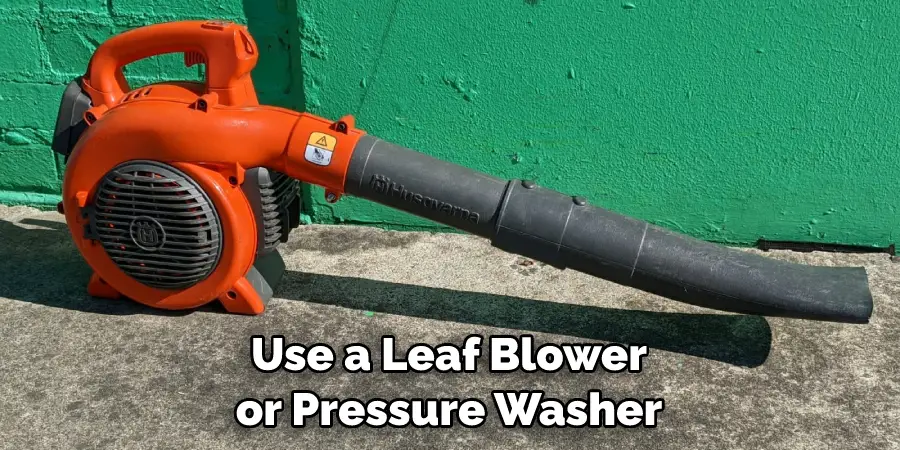 Use a Leaf Blower or Pressure Washer