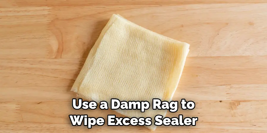 Use a Damp Rag to Wipe Excess Sealer