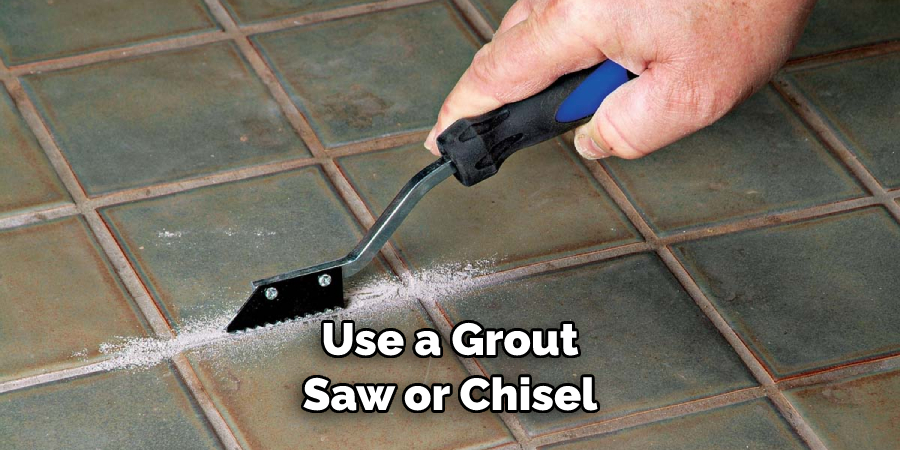 Use a Grout Saw or Chisel