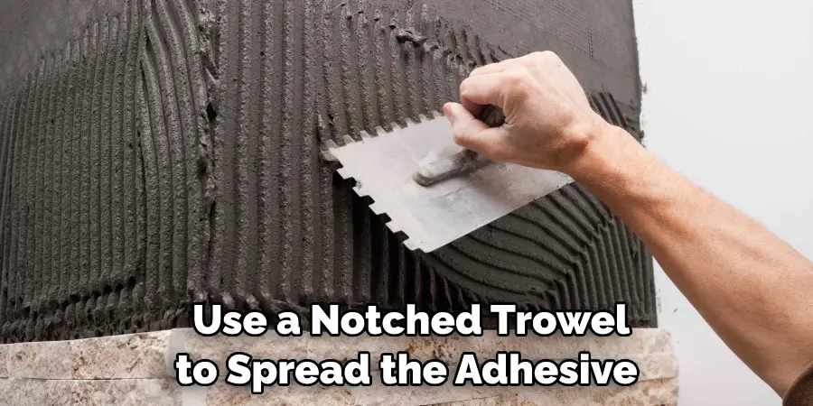 Use a Notched Trowel to Spread the Adhesive