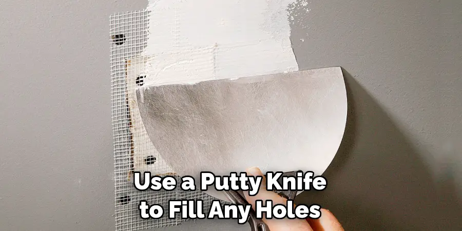 Use a Putty Knife to Fill Any Holes