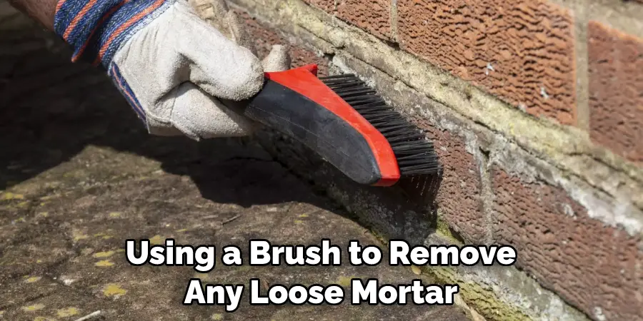 Using a Brush to Remove Any Loose Mortar