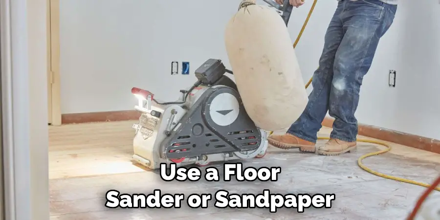 Use a Floor Sander or Sandpaper