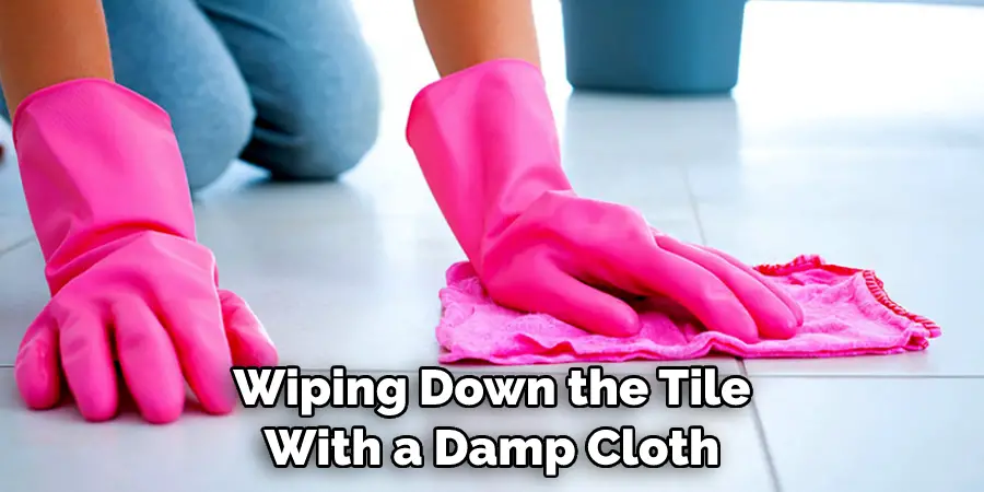 Wiping Down the Tile With a Damp Cloth