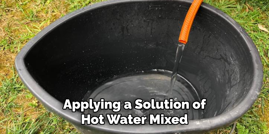 Applying a Solution of Hot Water Mixed