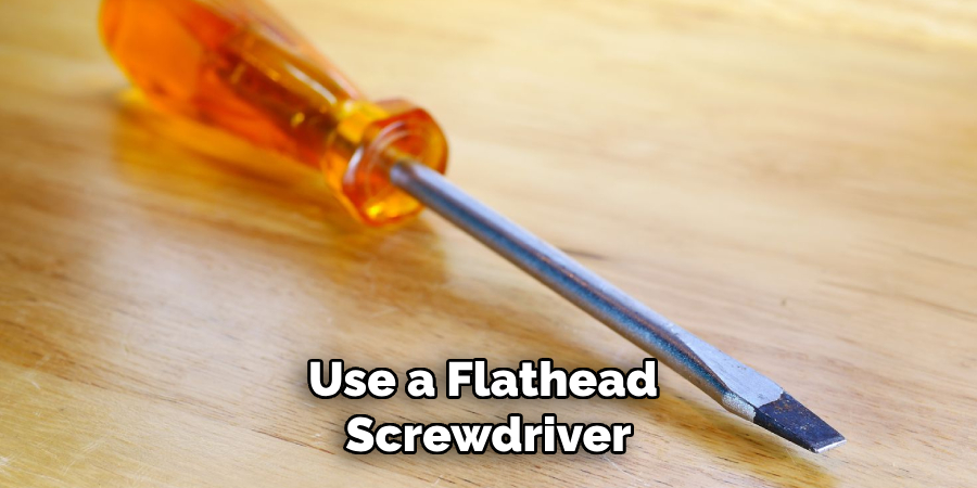 Use a Flathead Screwdriver