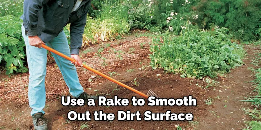 Use a Rake to Smooth Out the Dirt Surface