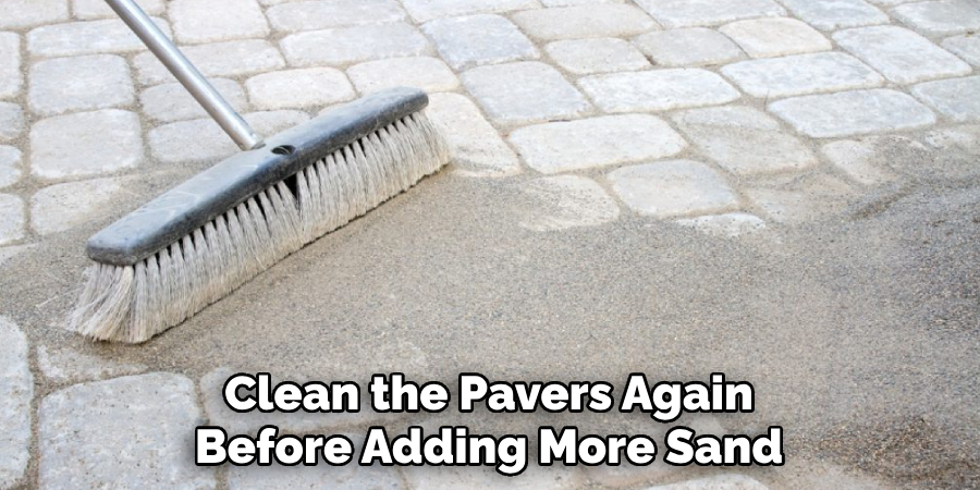 Clean the Pavers Again Before Adding More Sand
