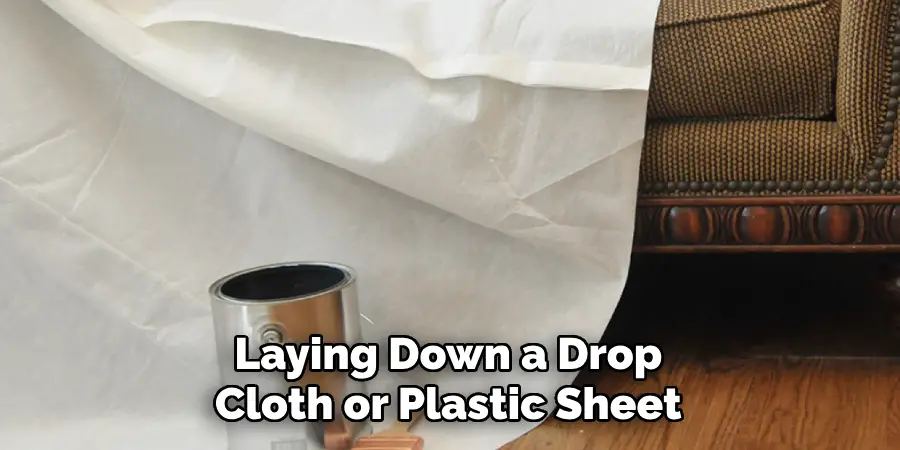 Laying Down a Drop Cloth or Plastic Sheet