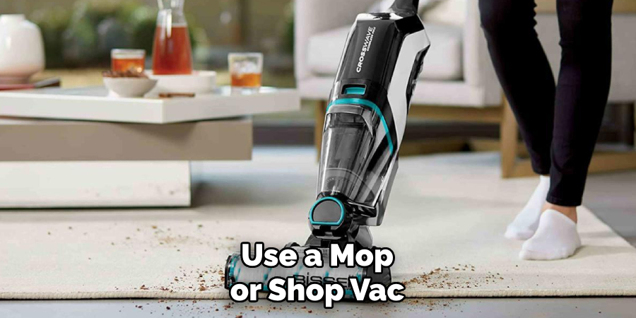 Use a Mop or Shop Vac