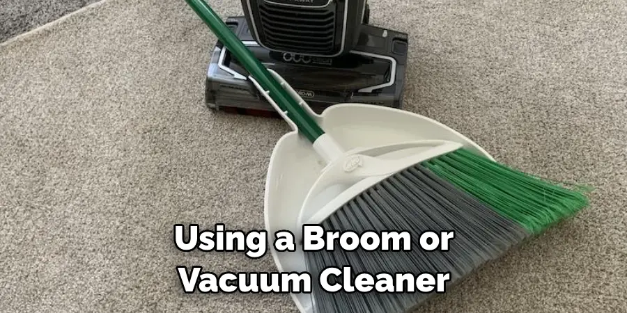 Using a Broom or Vacuum Cleaner