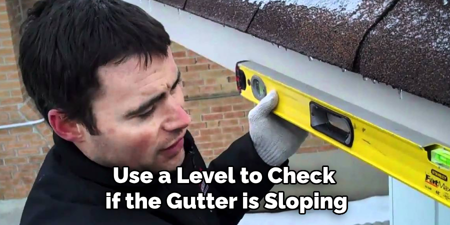 Use a Level to Check if the Gutter is Sloping