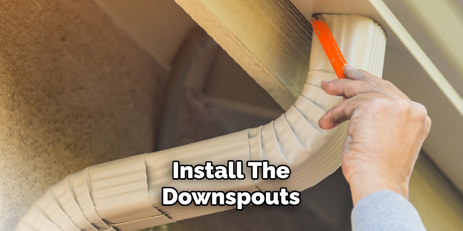  Install the Downspouts