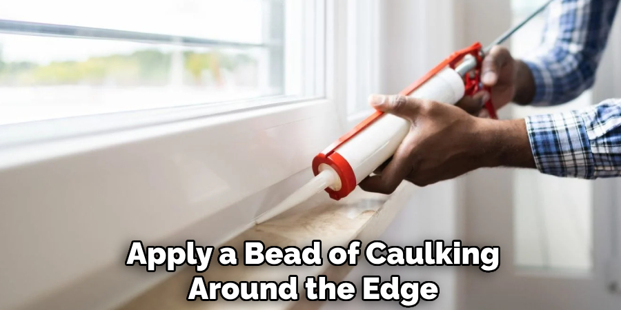 Apply a Bead of Caulking Around the Edge