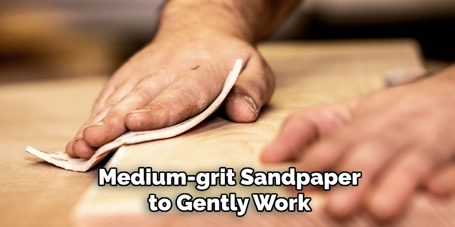 Medium-grit Sandpaper to Gently Work