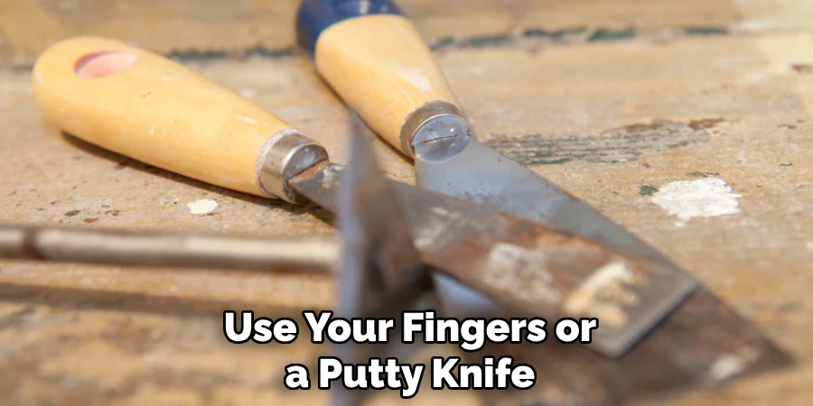 Use Your Fingers or a Putty Knife