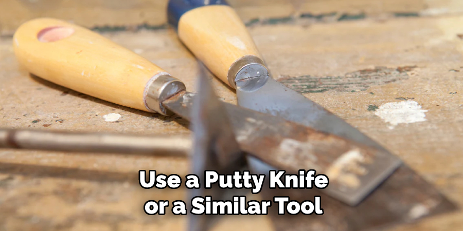 Use a Putty Knife or a Similar Tool