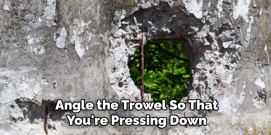 Angle the Trowel So That You're Pressing Down