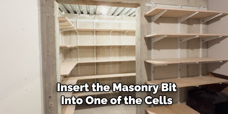 Insert the Masonry Bit Into One of the Cells