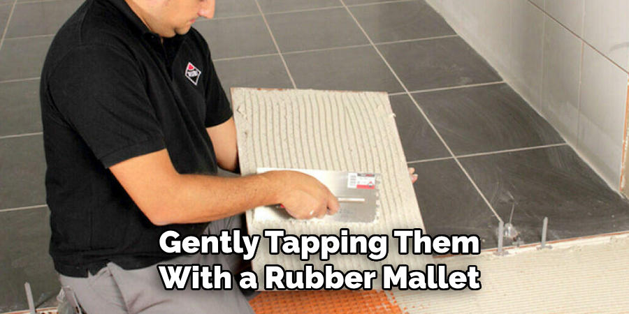 Gently Tapping Them With a Rubber Mallet
