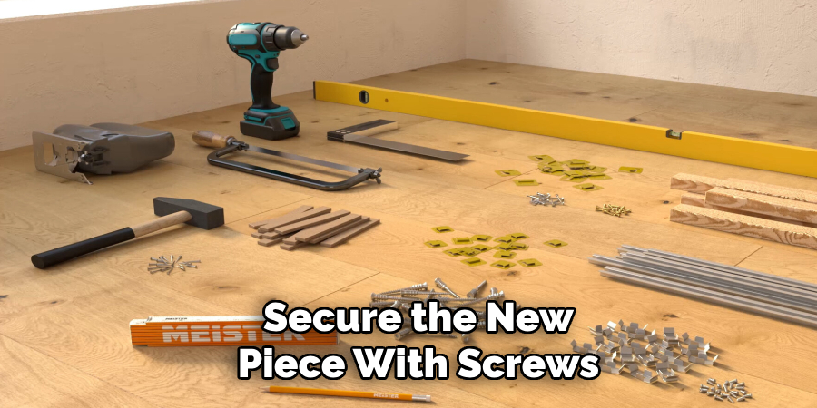 Secure the New Piece With Screws