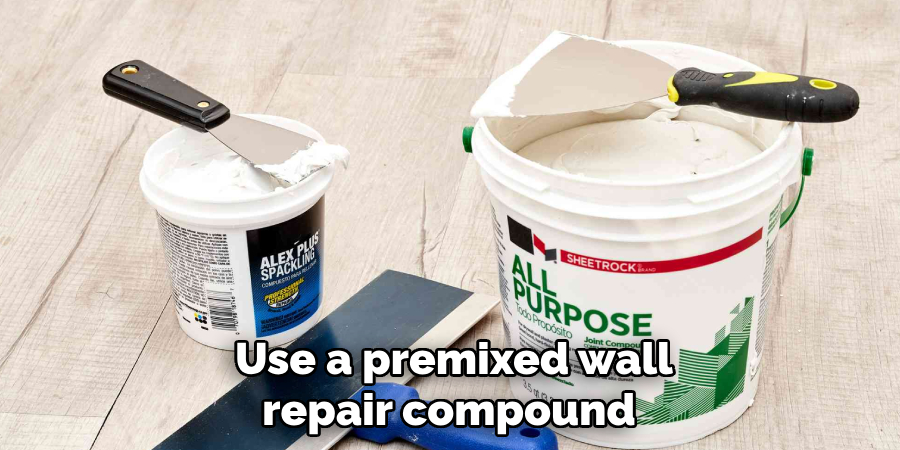 Use a premixed wall repair compound