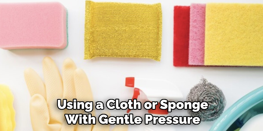 Using a Cloth or Sponge With Gentle Pressure