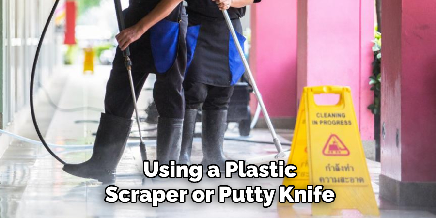 Using a Plastic Scraper or Putty Knife