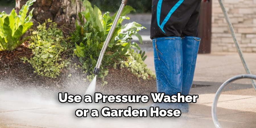 Use a Pressure Washer or a Garden Hose