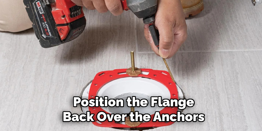  Position the Flange
 Back Over the Anchors