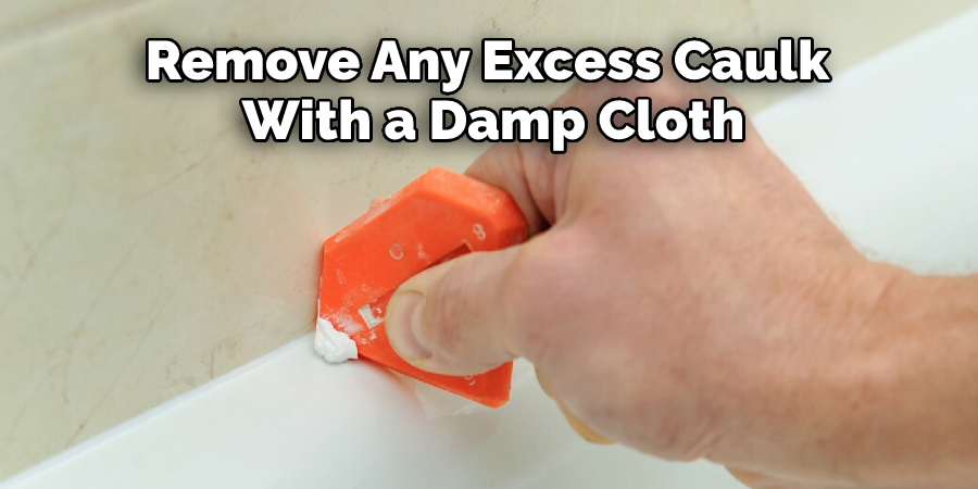 Remove Any Excess Caulk With a Damp Cloth