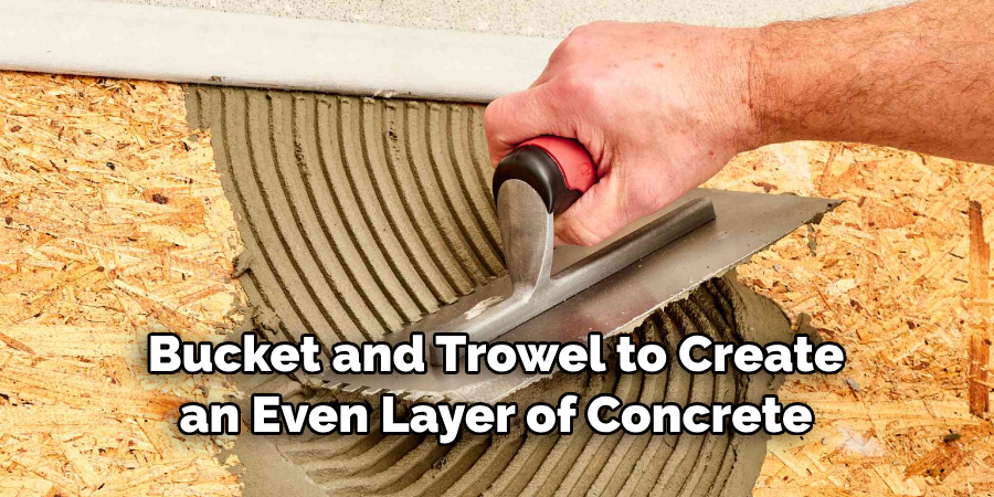 Bucket and Trowel to Create an Even Layer of Concrete