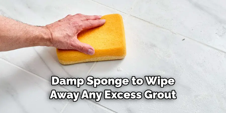 Damp Sponge to Wipe Away Any Excess Grout