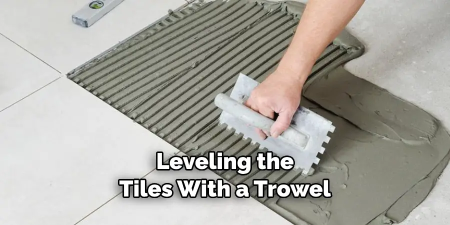 Leveling the Tiles With a Trowel