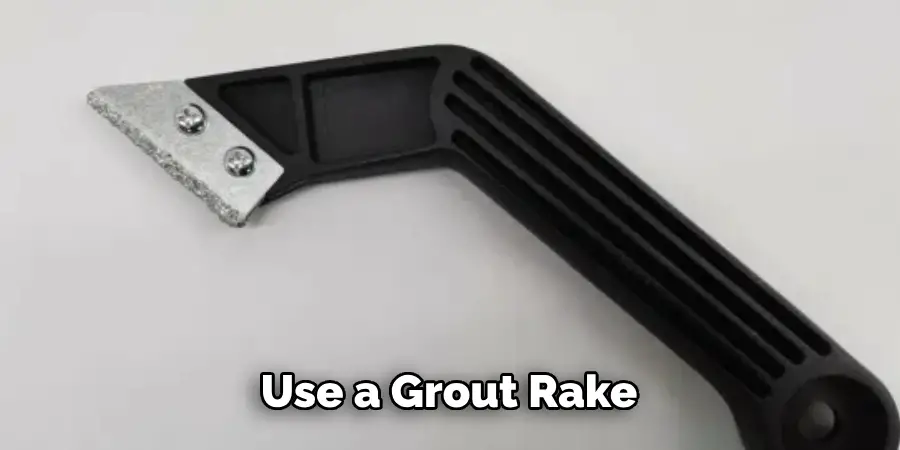 Use a Grout Rake